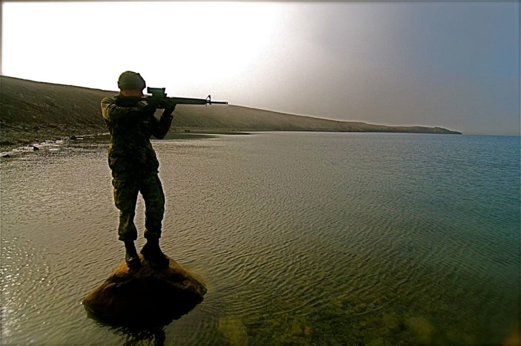 Devon Island, Nunavut.
A Canadian soldier stands guard at the edge of the Northwest Passage, an emerging shipping lane as the Arctic melts.