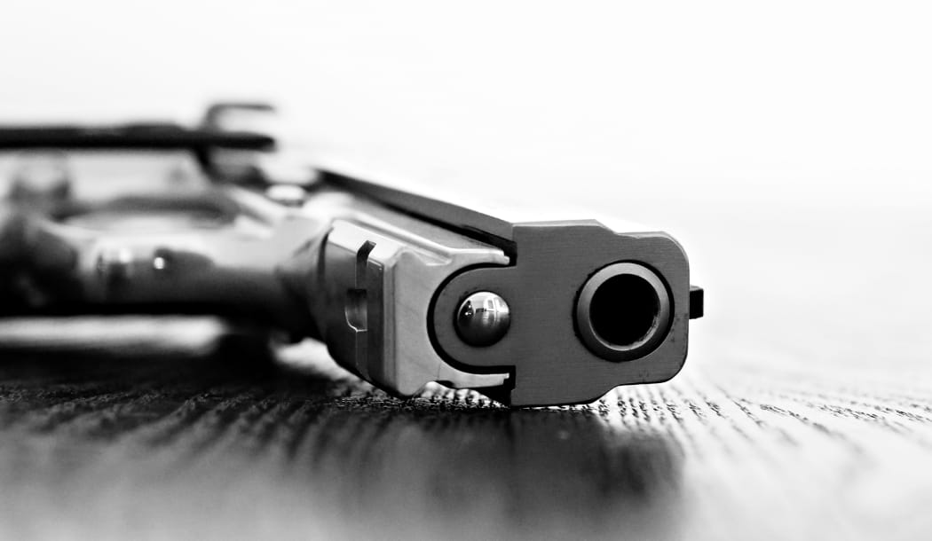 9mm gun resting on table