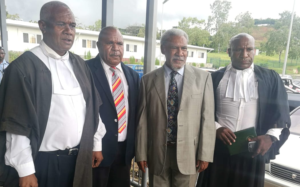 Sir Mekere Morauta (second from right) with his legal team after an election petition against him was dismissed, 13 February 2018.
