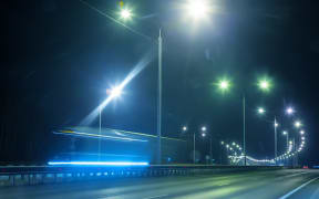 92567847 - winter highway at night shined with lamps