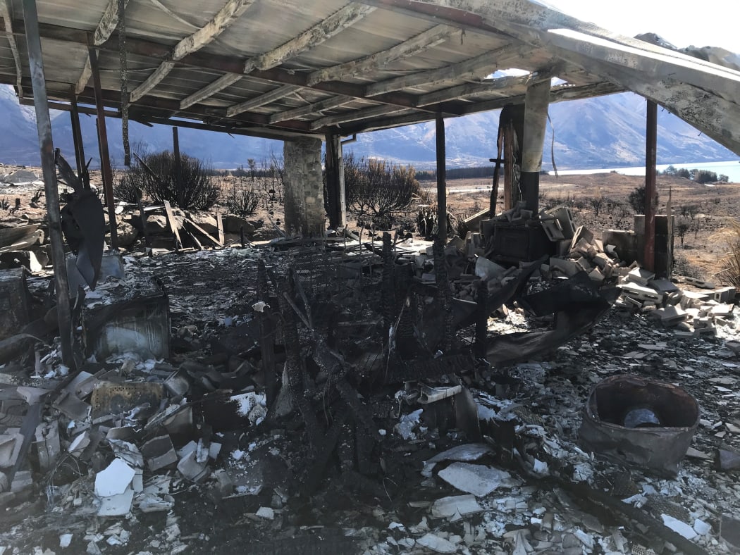 A fire-ravished home in Lake Ōhau Village.