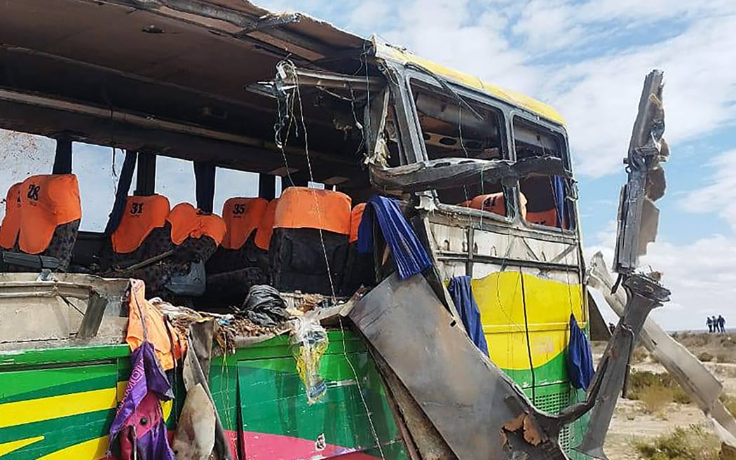 Handout picture released by Bolivian Police shows the wreckage of a bus that collided with another one on a highway near Uyuni, Bolivia on March 1, 2025. Two passenger buses collided in the early hours of March 1, 2025, on a highway in southern Bolivia, leaving at least 37 dead, including two children, and some 30 people injured, police said. (Photo by Handout / Bolivian Police / AFP) / RESTRICTED TO EDITORIAL USE - MANDATORY CREDIT "AFP PHOTO / BOLIVIAN POLICE / HANDOUT /  " - NO MARKETING NO ADVERTISING CAMPAIGNS - DISTRIBUTED AS A SERVICE TO CLIENTS