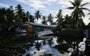The Maritime Academy is flooded at every high tide on the island of Amatuku. According to a former student, the litoral has lost ground for ten years.
The rising waters should make the Pacific low islands unviable long before they disappear.
L'academie maritime est inondee a chaque maree haute sur l'ile d'Amatuku. Selon un ancien eleve, le litoral a perdu du terrain depuis une dizaine d'annees.
La montee des eaux devrait rendre les iles basses du Pacifique invivables bien avant qu'elles ne disparaissent. (Photo by THEO ROUBY / Hans Lucas / Hans Lucas via AFP)