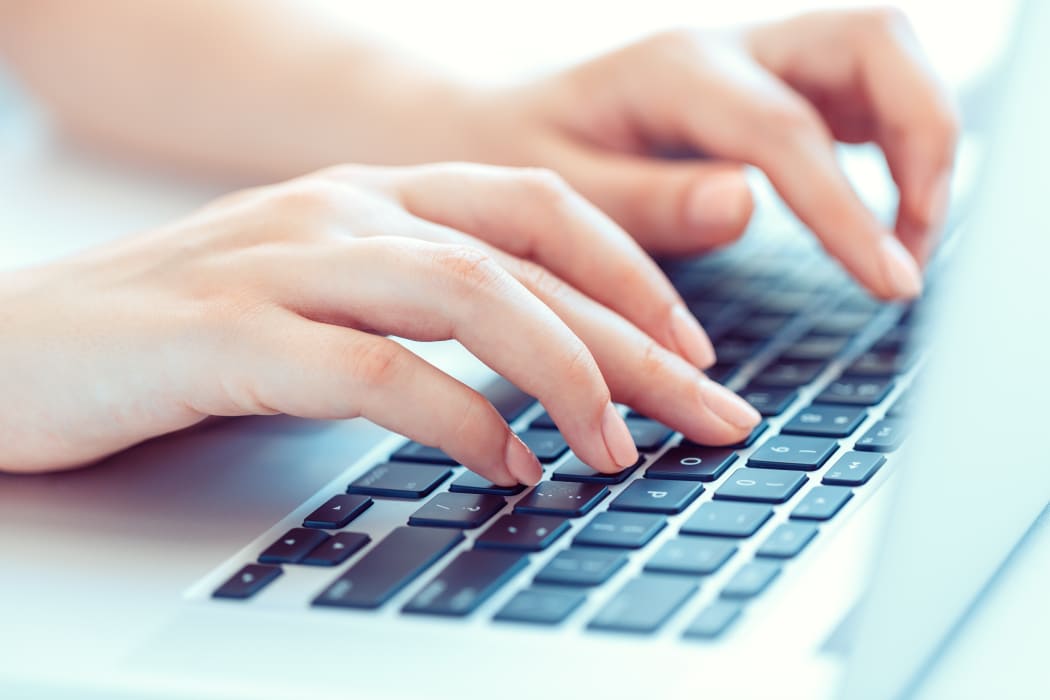 Female hands or woman office worker typing on the keyboard
