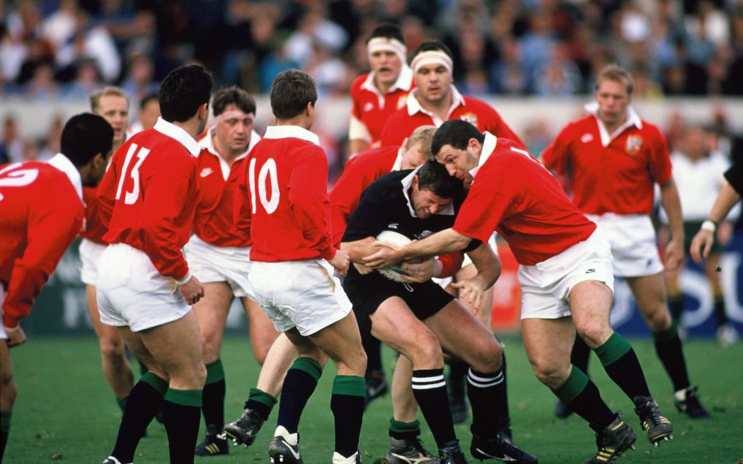 Sean Fitzpatrick tackled during the first All Blacks v Lions Test at Lancaster Park, Christchurch on 12 June 1993.