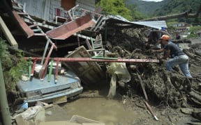 People search for relatives after the landslide.