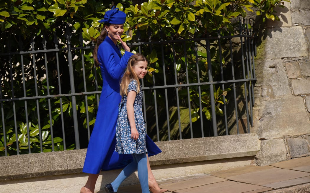 Britain's Catherine, Princess of Wales (L) and Britain's Princess Charlotte of Wales (R) leave after attending the Easter Mattins Service at St. George's Chapel, Windsor Castle on 9 April 9, 2023.