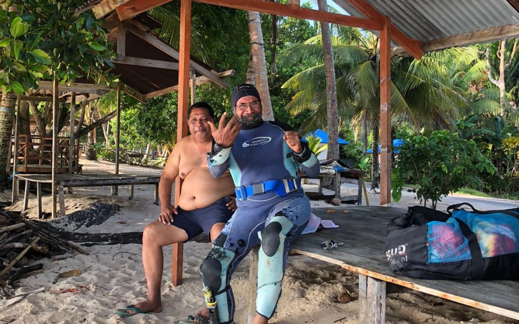 Filep Karma (right) with his brother-in-law George Waromi at Base G beach, Jayapura, Papua, on October 30, 2022. Karma said he planned to go spearfishing alone. His body washed ashore two days later. © 2022 Larz Barnabas Waromi