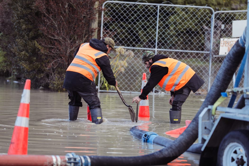 Clean up underway at Waikuku Beach.