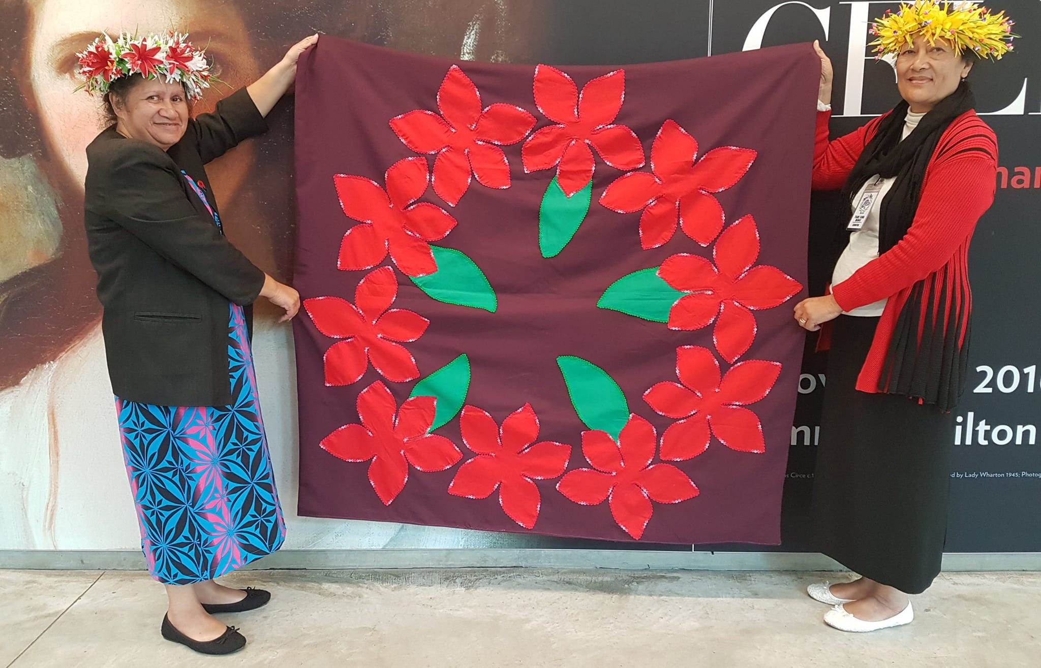 Two of the women with one of the tivaivai they made to commemorate their Cook Island ancestors who fought in World War One.