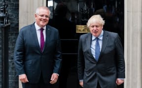 Australia's Prime Minister Scott Morrison, left, with Britain's Prime Minister Boris Johnson on the steps of 10 Downing Street in London, Britain, 14 June 2021.