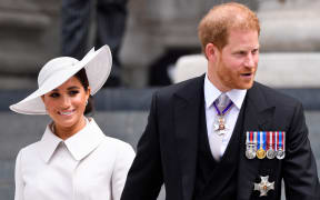 Britain's Prince Harry and his wife Meghan, the Duke and Duchess of Sussex, leave at the end of the National Service of Thanksgiving for The Queen's reign at Saint Paul's Cathedral in London on June 3, 2022 as part of Queen Elizabeth II's platinum jubilee celebrations.