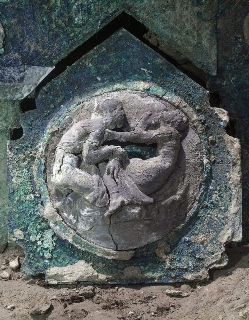 A photo handout on February 27, 2021 by the archaeological park of Pompeii shows a detail of a large Roman four-wheeled ceremonial chariot after it was discovered near the The archaeological park of Pompeii.