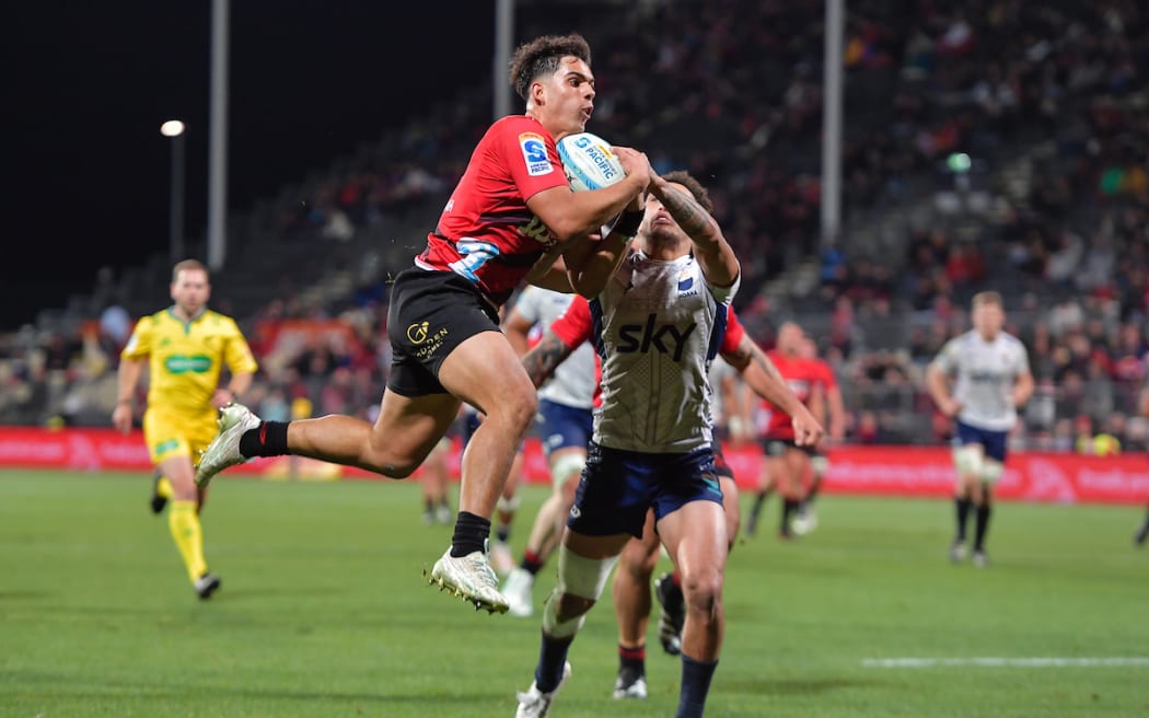 Noah Hotham of the Crusaders grabs the ball from William Havili of Moana Pasifika to score a try at the Apollo Projects Stadium, Christchurch, on 31 May, 2024.