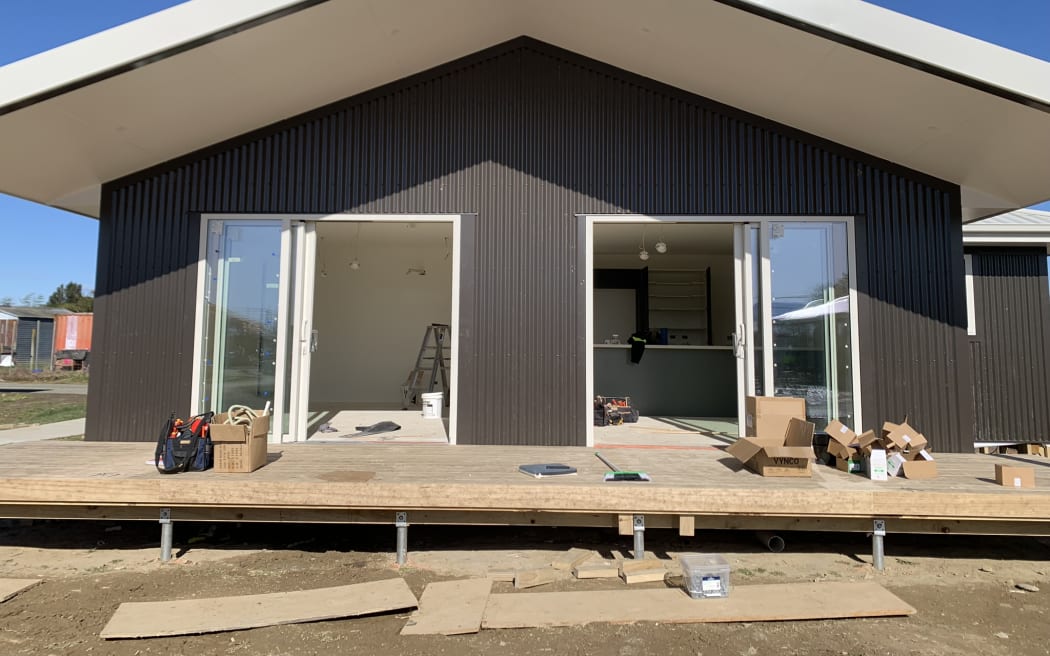 Four of the 20 whare in the new papakāinga development at Te Āwhina Marae in Motueka are on their way to completion, ready for whānau to move in next month.