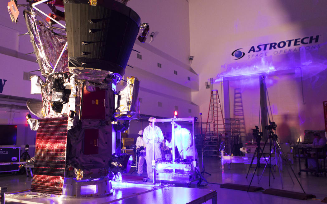 In the Astrotech processing facility in Titusville, Florida, near NASA's Kennedy Space Center, on Tuesday, June 5, 2018, technicians and engineers perform light bar testing on NASA's Parker Solar Probe. The Parker Solar Probe will launch on a United Launch Alliance Delta IV Heavy rocket from Space Launch Complex 37 at Cape Canaveral Air Force Station in Florida no earlier than Aug. 4, 2018. The mission will perform the closest-ever observations of a star when it travels through the Sun's atmosphere, called the corona. The probe will rely on measurements and imaging to revolutionize our understanding of the corona and the Sun-Earth connection.