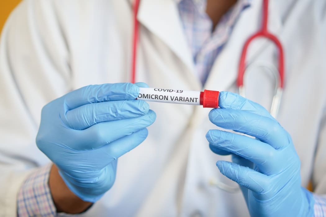 A test tube labelled with Omicron variant.
