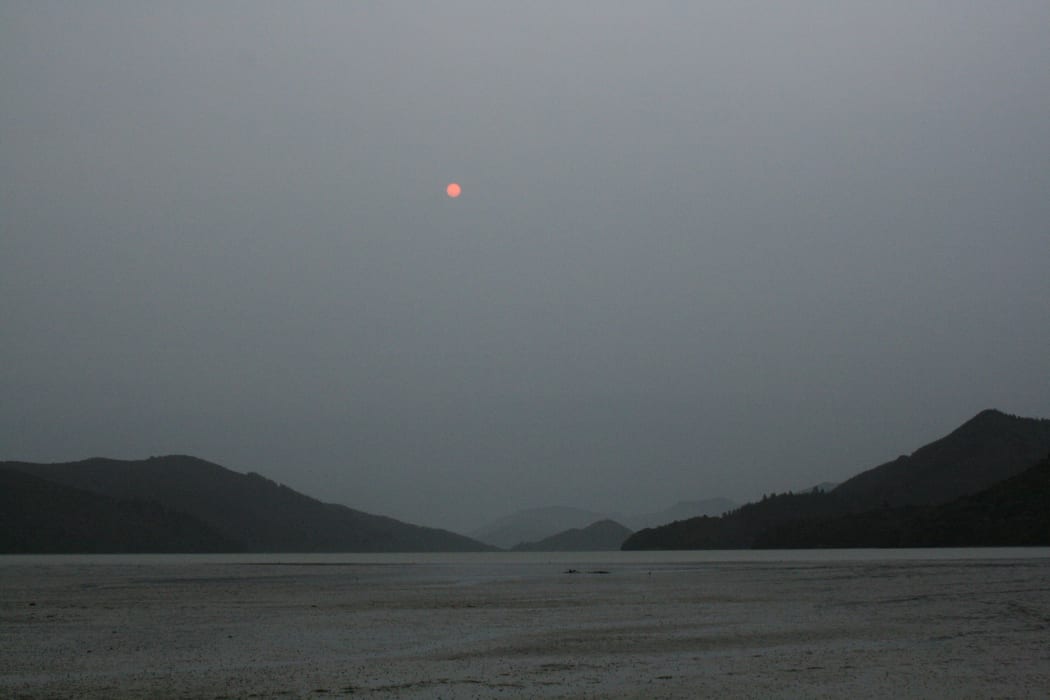 Smoke-filled skies at Kenepuru Heads, Marlborough