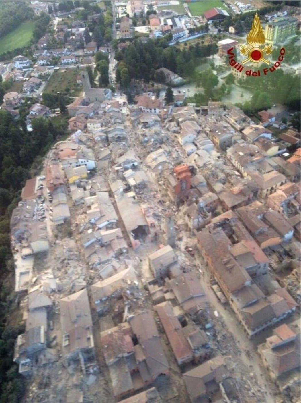 A handout picture provided by Vigili del Fuoco shows aerial view of damaged houses after the magnitude 6.2 earthquake has struck Amatrice region of Rieti, Italy on August 24, 2016. Vigili del Fuoco / Handout / Anadolu Agency