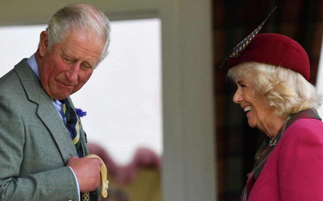 Britain's Prince Charles, Prince of Wales and Britain's Camilla, Duchess of Cornwall gesture during the annual Braemar Gathering in Braemar, central Scotland, on September 7, 2019.