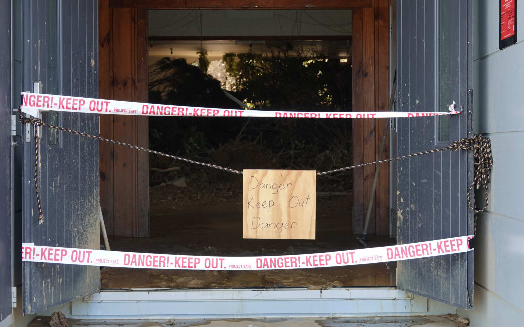 A cleanup of the slip-damaged Ōakura Community Hall is on hold until the building can be assessed by council engineers.