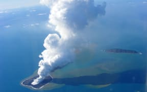 A 2009 aerial photo of ash rising into the air from an undersea volcanic eruption that formed the world's youngest island.