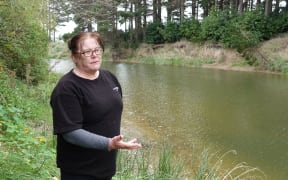 Nikki Cumming worries about the possibility of another flood if the Wainui River isn't regularly cleaned of debris.