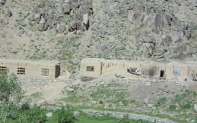 The book's authors said this photo showed Fatima's house, centre, which was seriously damaged at the time of the raid but had since been rebuilt.