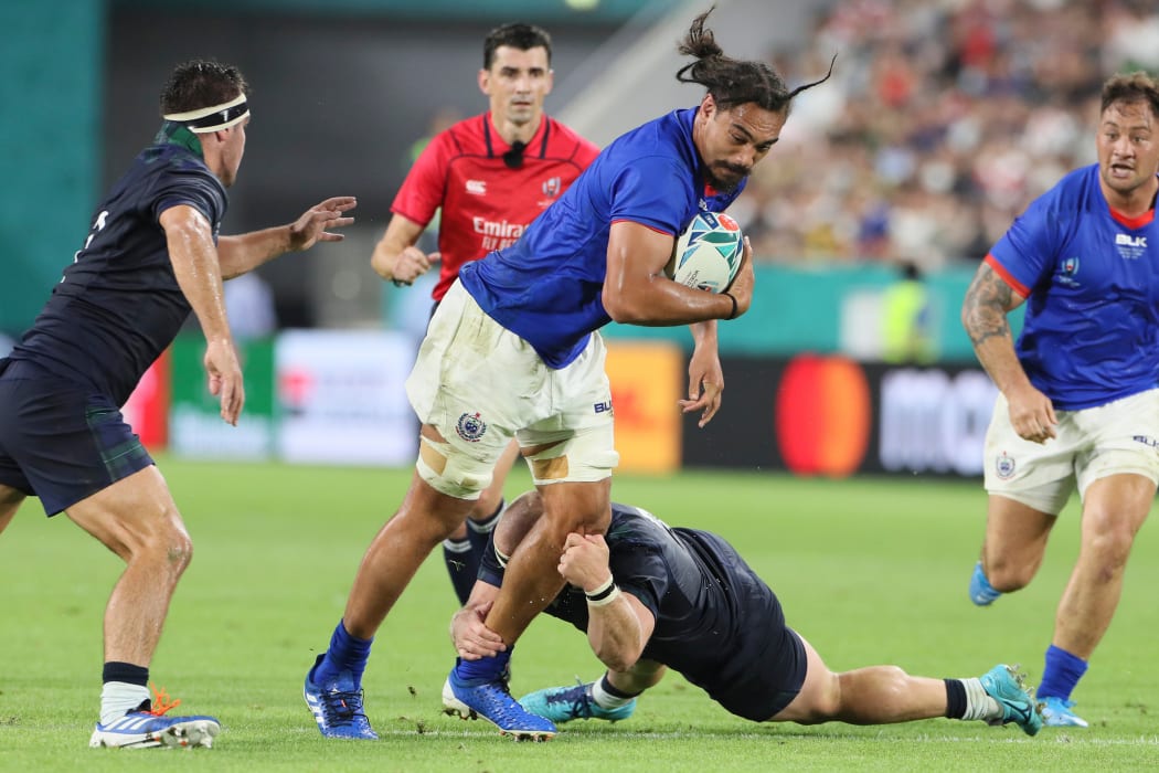 Samoa flanker Chris Vui tries to break Scotlish defence.