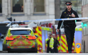 Police and emergency vehicles gather near London Bridge in London, on 29 November 2019 after a man wearing a suspected hoax explosive device was shot dead by armed officers on London Bridge after a stabbing spree police said was a terrorist incident.