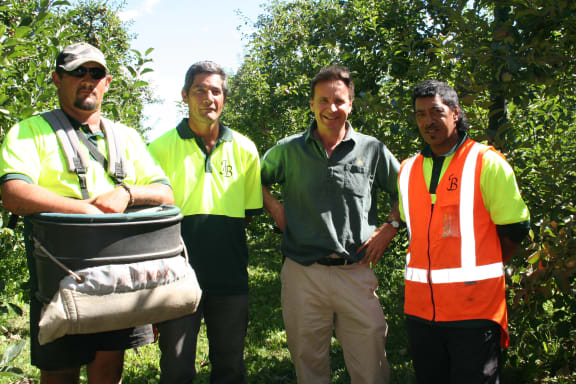 (From left to right) Graduates Bill Neilson and Mahi Hauparoa, with John Bostock and Jason Cunningham on Downs Orchard near Flaxmere.