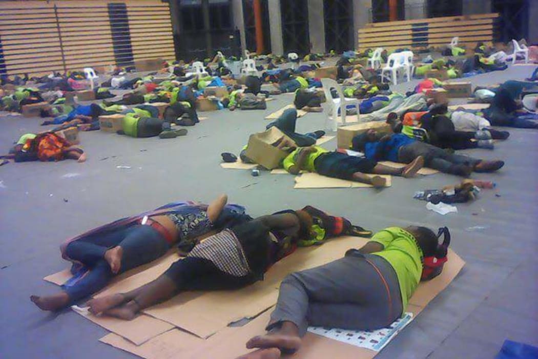 Papua New Guinea election polling officers sleep rough in stadium in the capital, Port Moresby.
