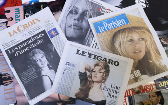 Illustration of a montage of French newspapers La Croix, Le Figaro, Liberation and Le Parisien, whose front page pays tribute to the former French actress and animal rights activist Brigitte Bardot following her death the previous day in a newsagent's in Paris, France, on December 29, 2025.