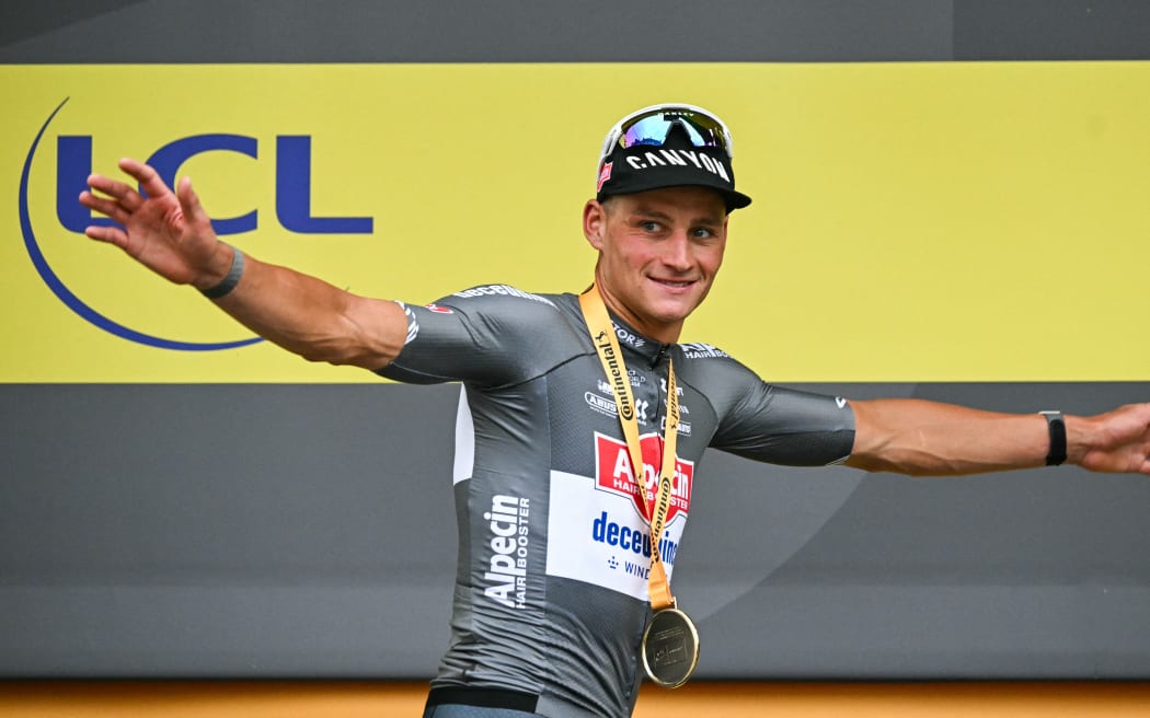 Alpecin-Deceuninck team's Dutch rider Mathieu van der Poel celebrates on the podium after winning the second stage of the 2nd stage of the Tour de France, northern France, 6 July, 2025. (Photo by Loic VENANCE / AFP)