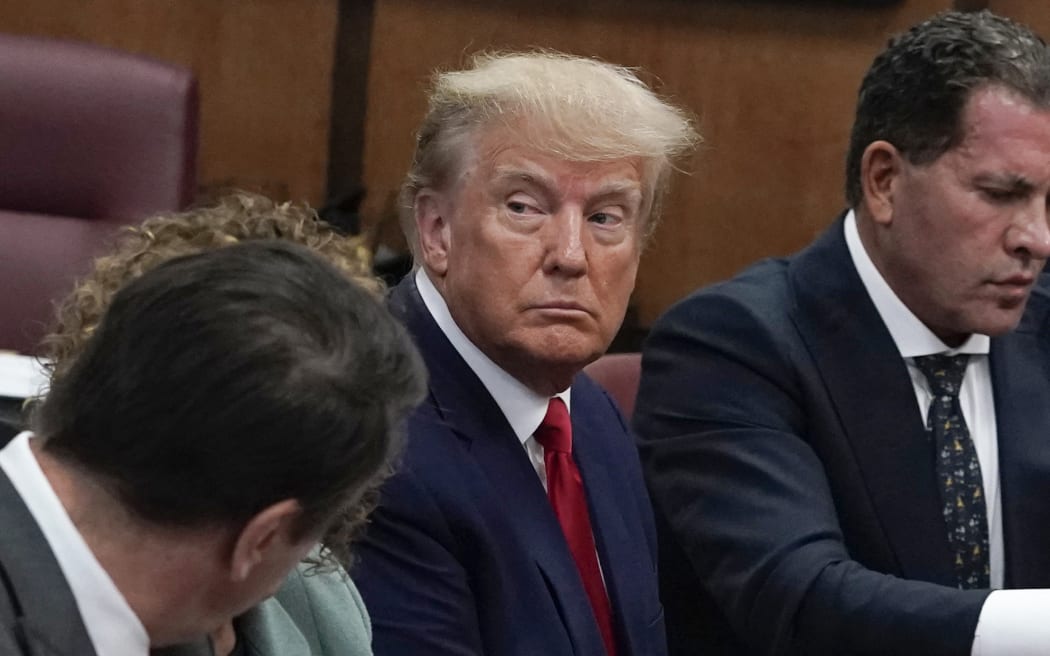 Former US president Donald Trump appears in court at the Manhattan Criminal Court in New York on April 4, 2023. - Former US president Donald Trump arrived for a historic court appearance in New York on Tuesday, facing criminal charges that threaten to upend the 2024 White House race. (Photo by Seth WENIG / POOL / AFP)