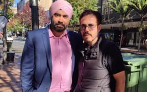 Migrant rights advocate Sunny Sehgal [left], with Sher Singh from the Migrant Rights Network.