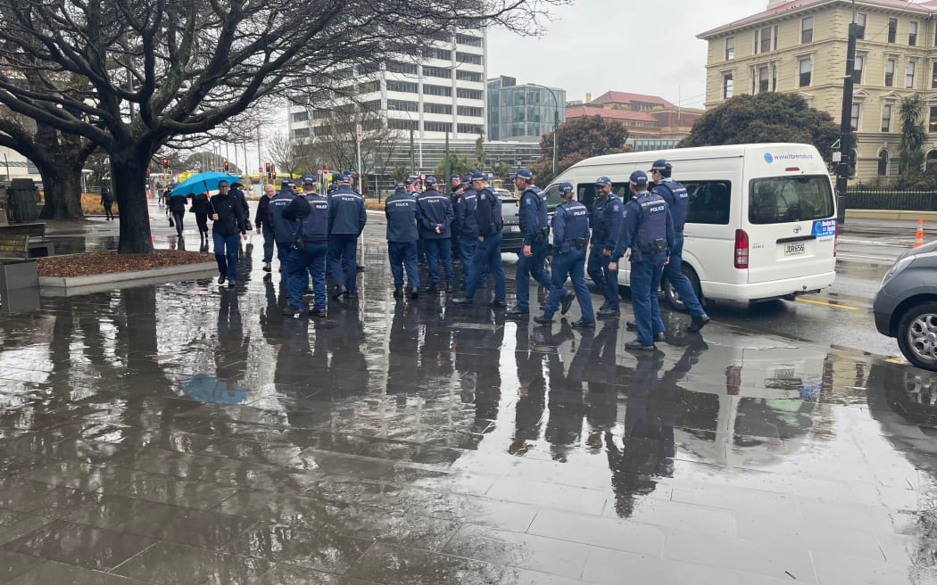 Police gather at the entrance to parliament grounds after streets surrounding parliament were closed off on Wednesday 27 September 2023.