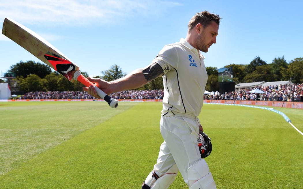 Brendon McCullum acknowledges the crowd after hitting a world record test century.