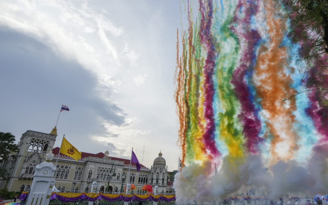 Fireworks shoot up in to sky at government house in Bangkok, Thailand, Tuesday, June 18, 2024. Thailand’s Senate voted overwhelmingly on Tuesday to approve a bill that would legalize same-sex marriage, clearing the last legislative hurdle for the country to become the first in Southeast Asia to enact such a law. (AP Photo/Sakchai Lalit)