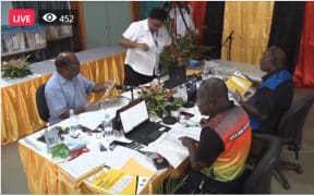 An action shot of election officials counting Vanuatu's election results.