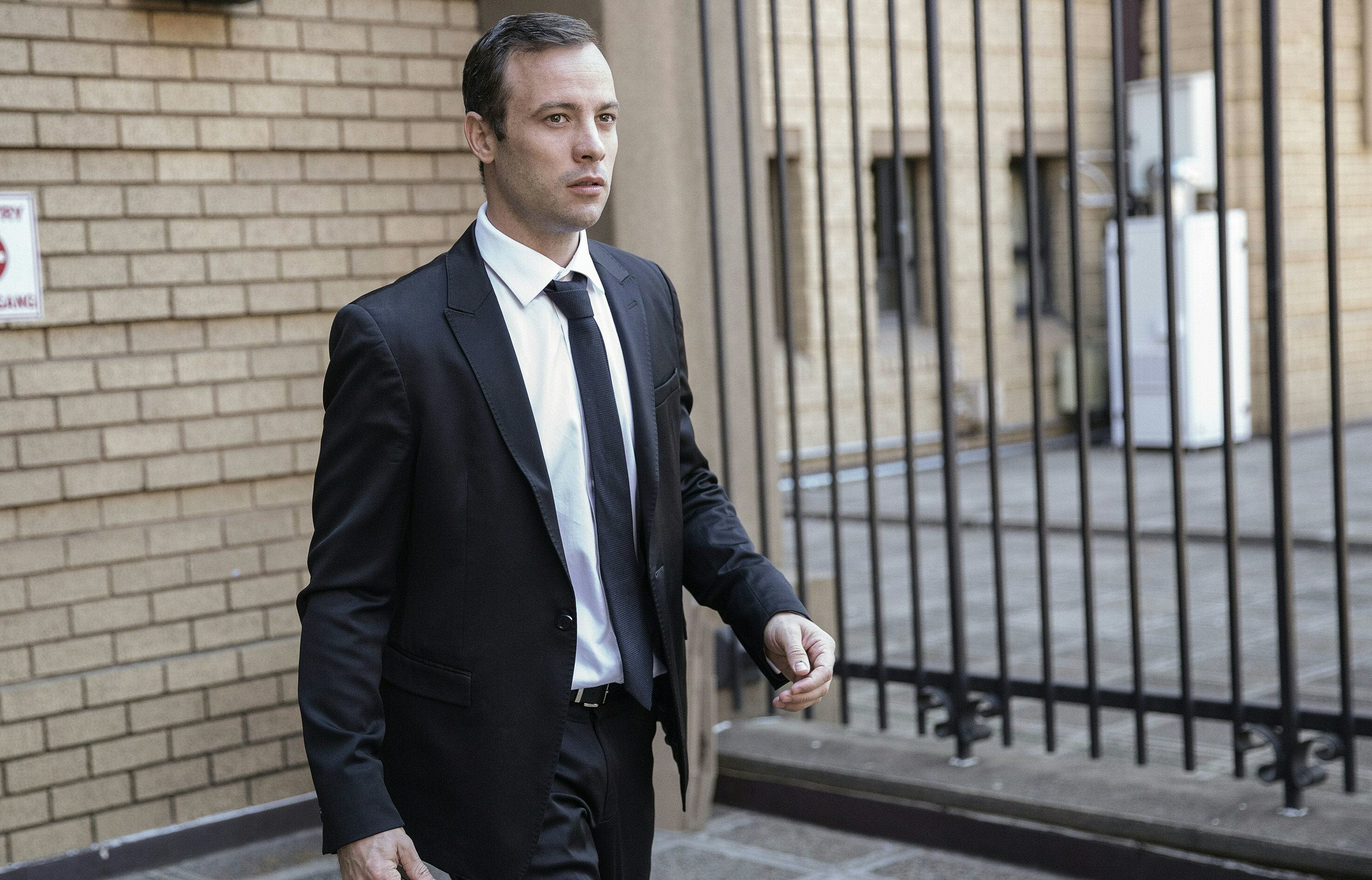 Oscar Pistorius leaving Pretoria High Court on 18 April 2016 after his murder case hearing was postponed.