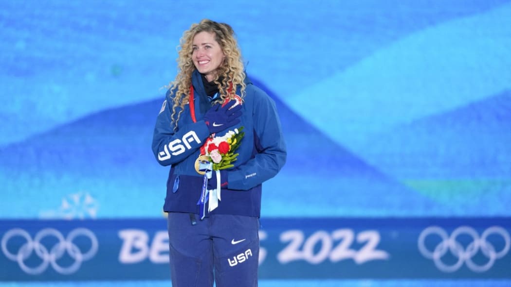 (220209) -- ZHANGJIAKOU, Feb. 9, 2022 (Xinhua) -- Gold medalist Lindsey Jacobellis of the United States reacts during the awarding ceremony of women's snowboard cross at Zhangjiakou Medals Plaza of the Winter Olympics in Zhangjiakou, , Feb. 9, 2022. (