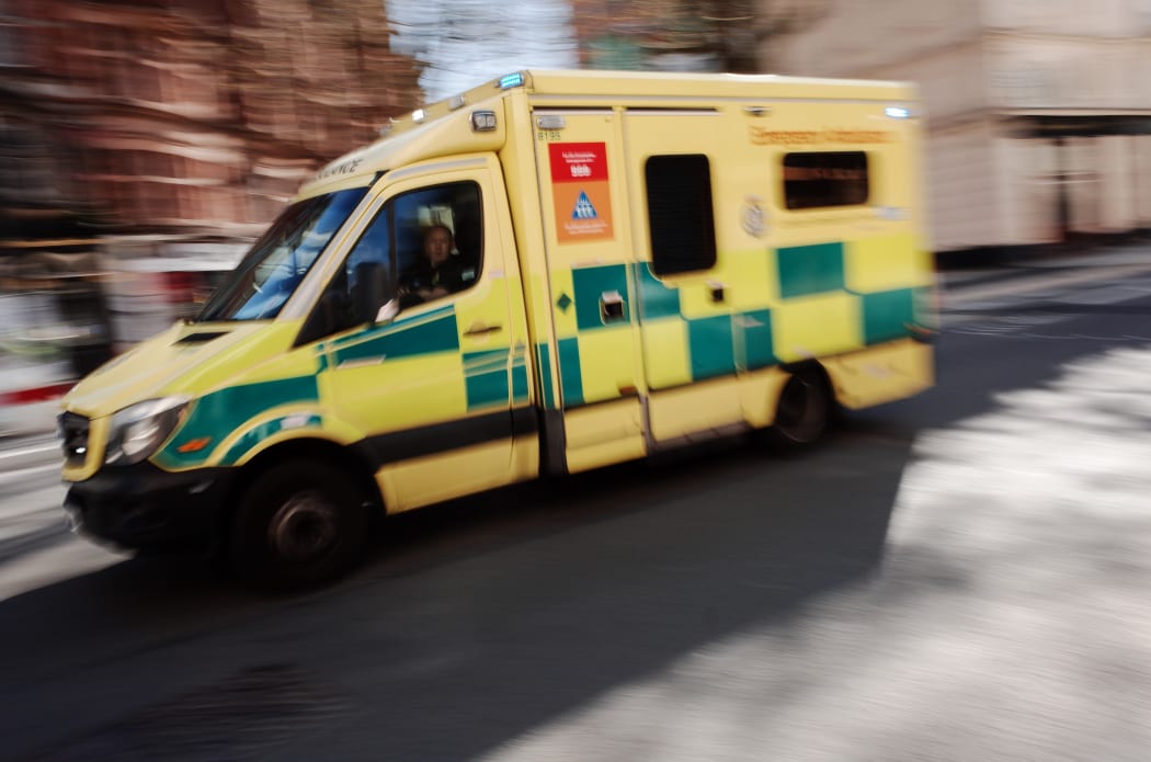 An ambulance operated by the National Health Service (NHS) races along New Oxford Street in London, England, on April 4, 2020.