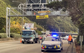 Protesters unfurled a banner across SH1 near Bowen St in Wellington on 31 August 2023.