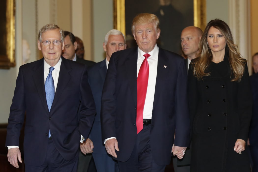 Donald Trump with wife Melania Trump and vice-president elect Mike Pence before meeting senior Republicans in Washington.