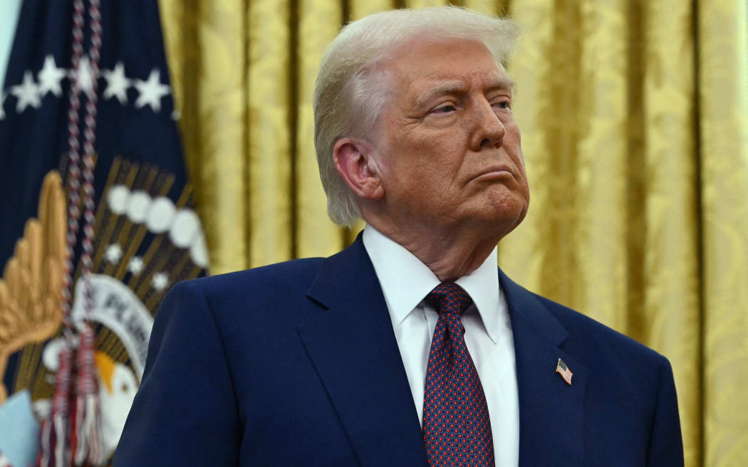 US President Donald Trump listens as the new US Secretary of Health and Human Services Robert F. Kennedy Jr., speaks after being sworn in at the Oval Office of the White House in Washington, DC, on February 13, 2025. (Photo by ANDREW CABALLERO-REYNOLDS / AFP)
