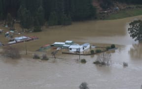 Flooded houses and sheds in a rural area near Henley, on the Taieri Plain, after the July winter storm on 20-22 July 2017.
