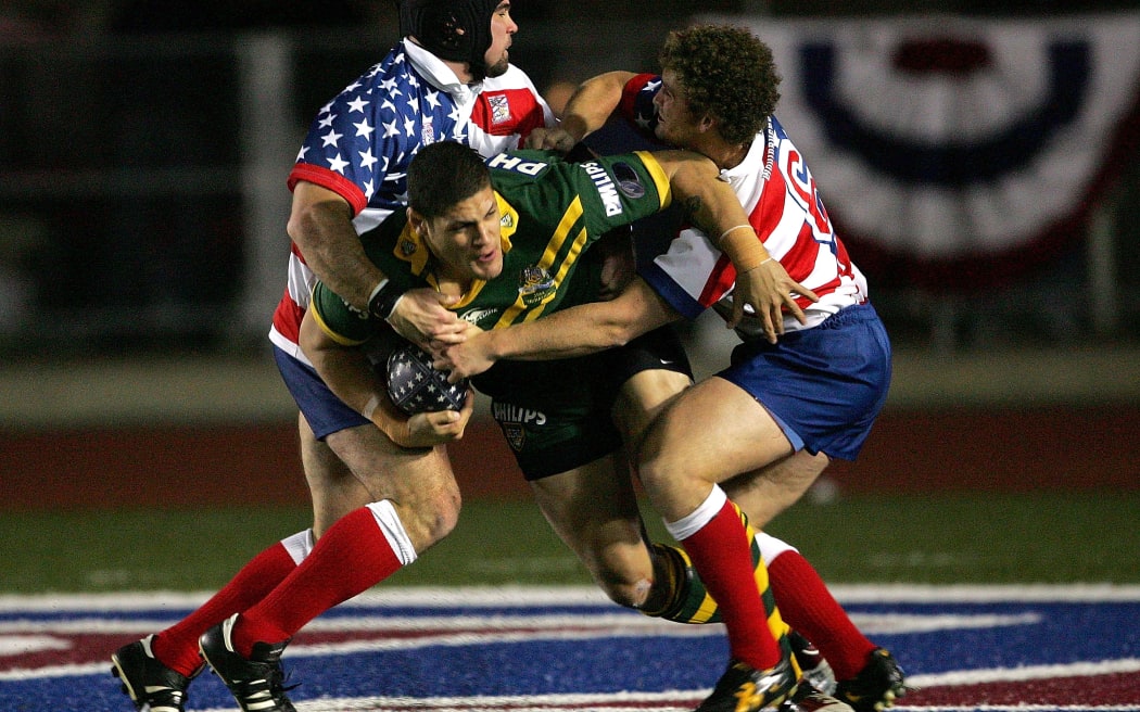 Willie Mason #8 of the Philips Kangaroos scores a try as Matt Petersen #6 of the USA Tomahawks tackles during the Liberty Bell Cup at Franklin Field on November 30, 2004.