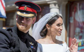 Prince Harry, Duke of Sussex and Meghan Markle, Duchess of Sussex in the Ascot Landau carriage during the procession on The Long Walk after getting married St George's Chapel, Windsor Castle.