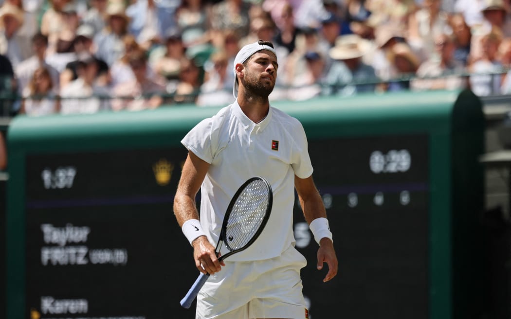 Karen Khachanov reacts as he plays against Taylor Fritz of United States during their men's singles quarter-finals match at Wimbledon, 8 July, 2025. (Photo by Daisuke Urakami / The Yomiuri Shimbun via AFP)